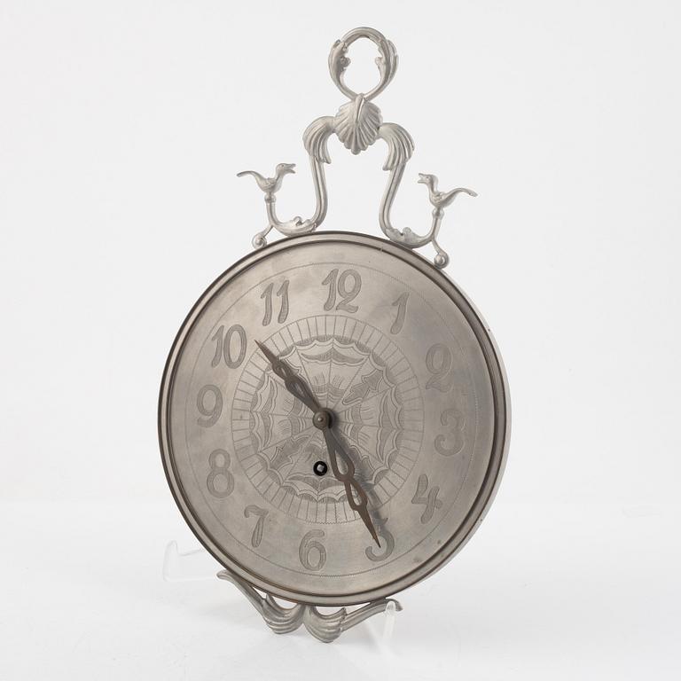 Nils Fougstedt, a pewter and brass wall clock, Svenskt Tenn, Stockholm 1935, model "A 618".