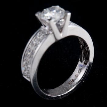A RING, brilliant cut diamond 0.92 ct. G/vs2 + 36 brilliant cut diamonds  0.36 ct. IGI certificate.
