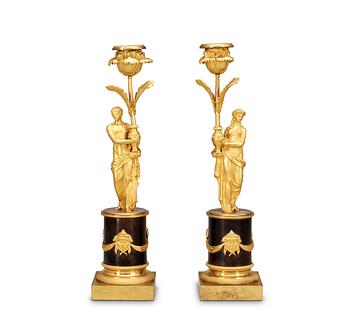 519. A pair of Louis XVI late 18th Century candlesticks.