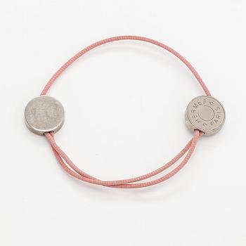 Hermès, A "Coulisse" bracelet made of metal and cord. Marked Hermès Paris.