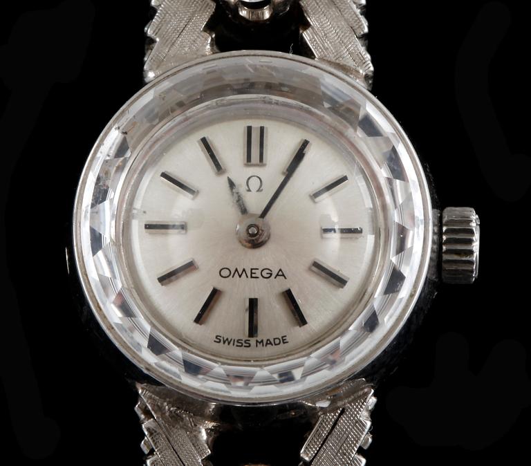 DAMARMBANDSUR, Omega, 18k vitguld med 6 briljantslipade diamanter tot ca0,2ct, 1960-tal.