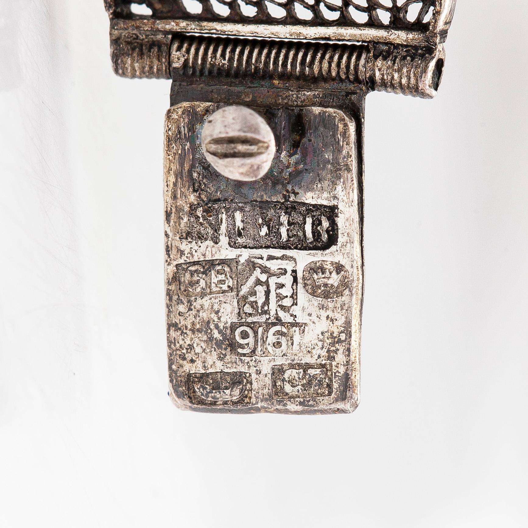 A jewelry set, bracelet, ring, and earrings, silver .916, enamel, and tiger's eye, Finnish import hallmarks 1956.