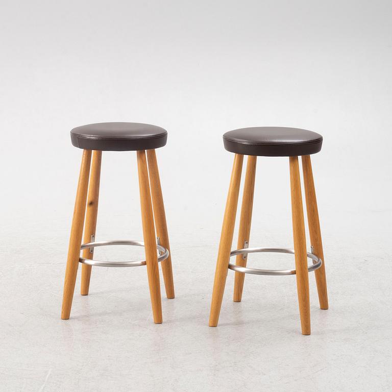 Hans J. Wegner, a pair of bar stools, CH 58, Carl Hansen & Son, Denmark, 21st century.