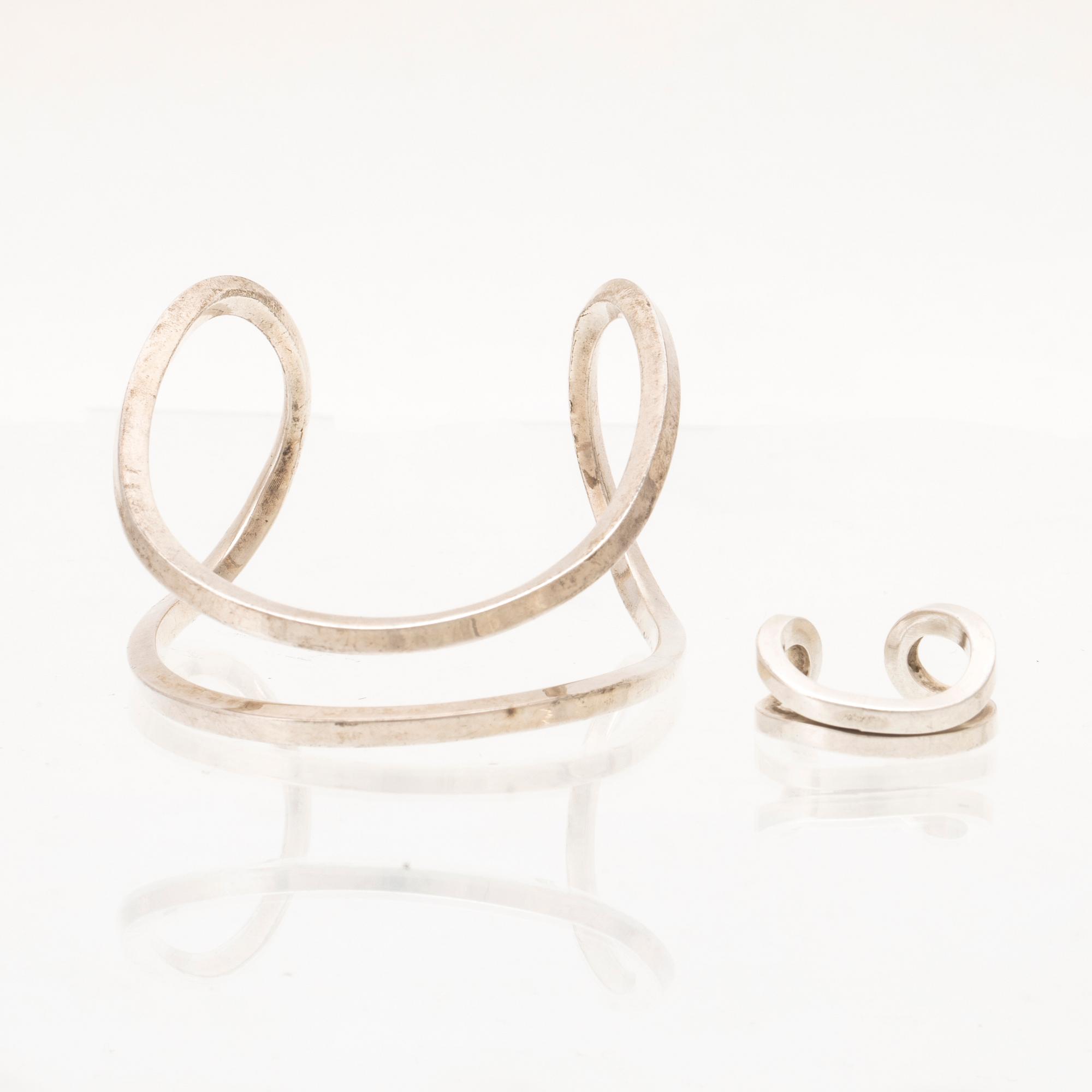 A silver ring and bracelet "loop cuff" by Efva Attling.