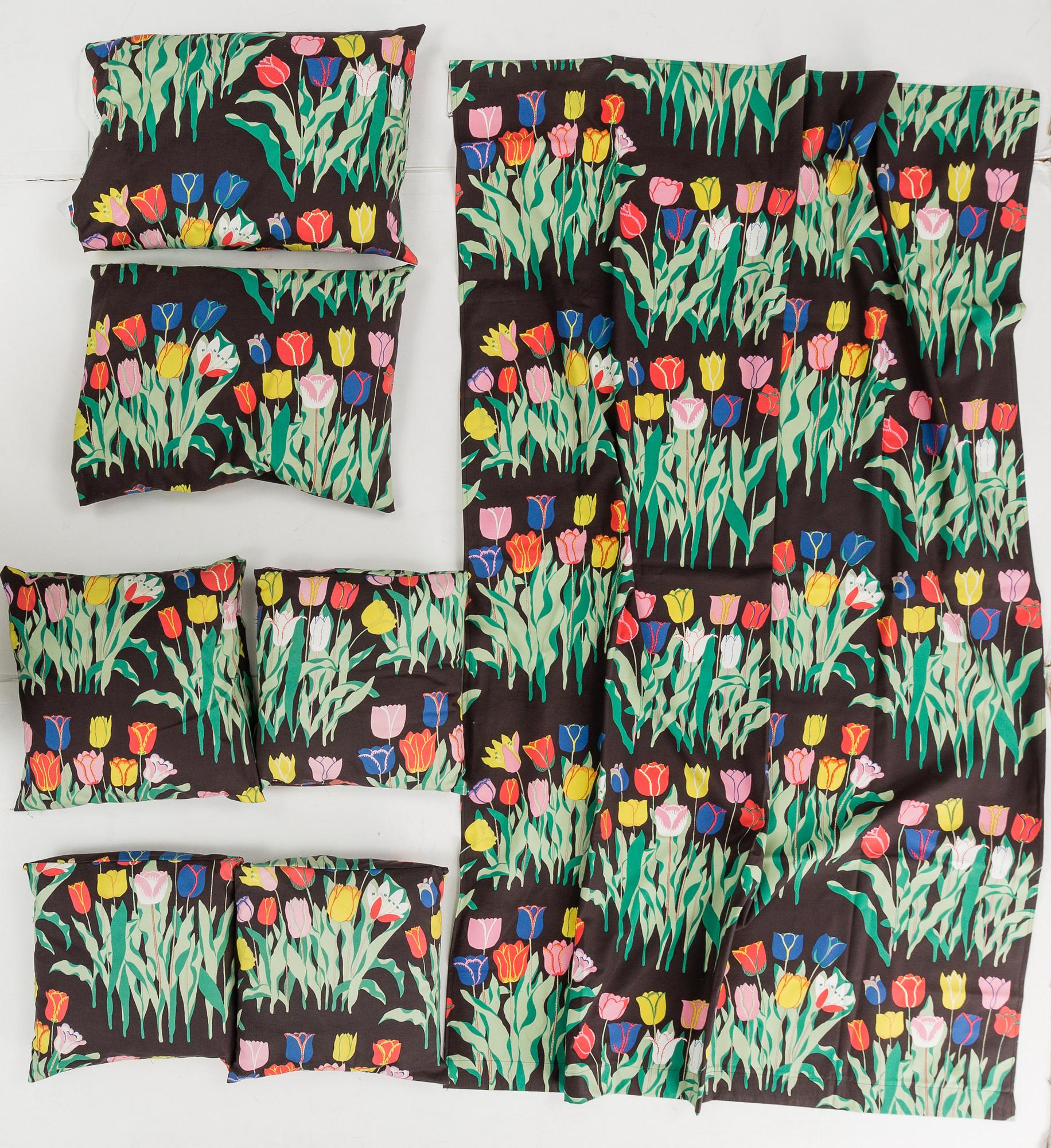 A cotton curtain and 6 pillows, in the textile "Tulpan", Firma Svenskt Tenn.