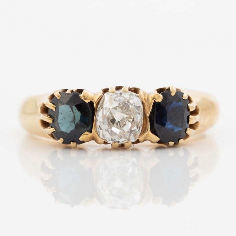 Ring 14K gold with an old-cut diamond and two blue stones.