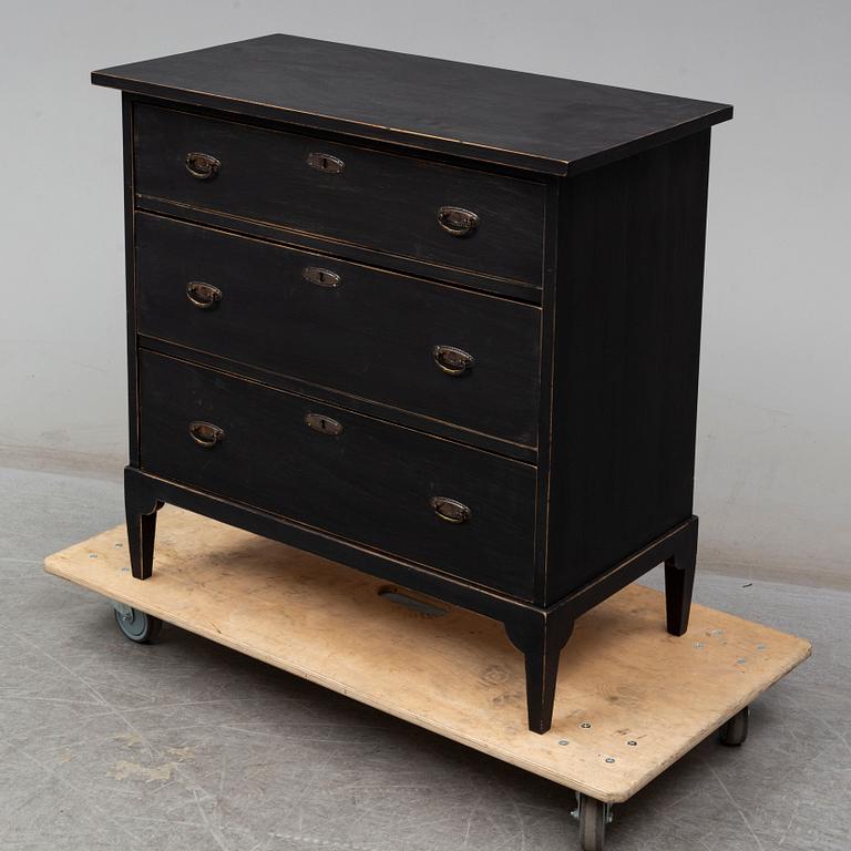 a chest of drawers from the first half of the 20th century.