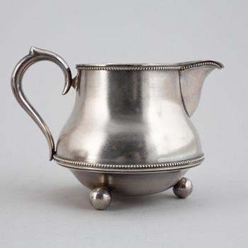 A parcel-gilt silver creamer and bowl, St Petersburg 1898-1903.