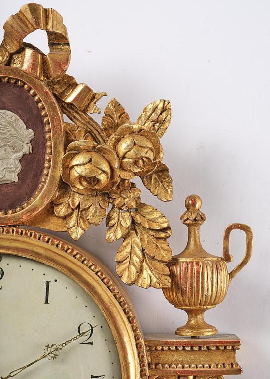 A late Gustavian giltwood cartel clock by J. Nyberg (master in Stockholm 1787-1801).