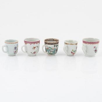 A Chinese porcelain set of cups, saucers and vase, Qing Dynasty, mostly Qianlong (1736-95) (13 pieces).