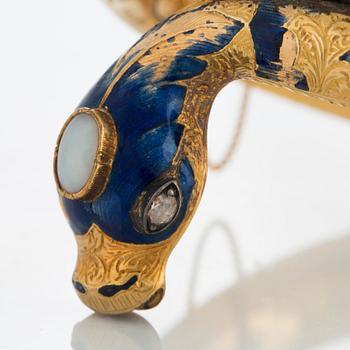 An 18K gold snake bangle decorated with blue enamel and set with an opal and a rose-cut diamond.