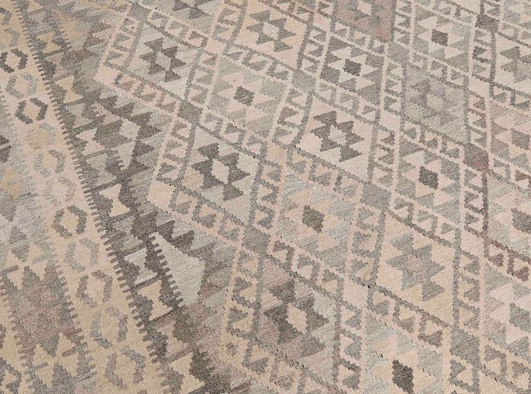 A Kelim carpet, 295 x 210 cm.
