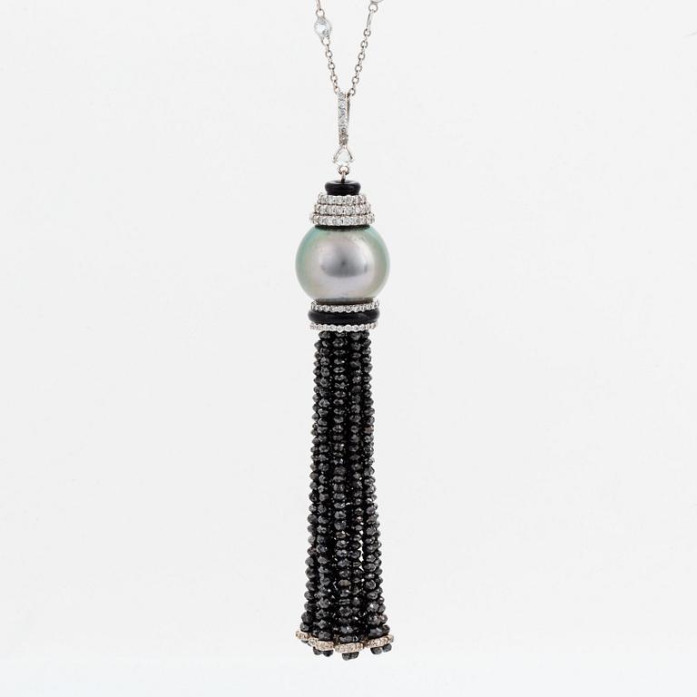 An Ebba Brahe 18K white gold tassel pendant with a cultured Tahitian pearl and white and black diamonds.