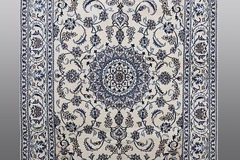 A carpet Nain, part silk, ca 290 x 196 cm.