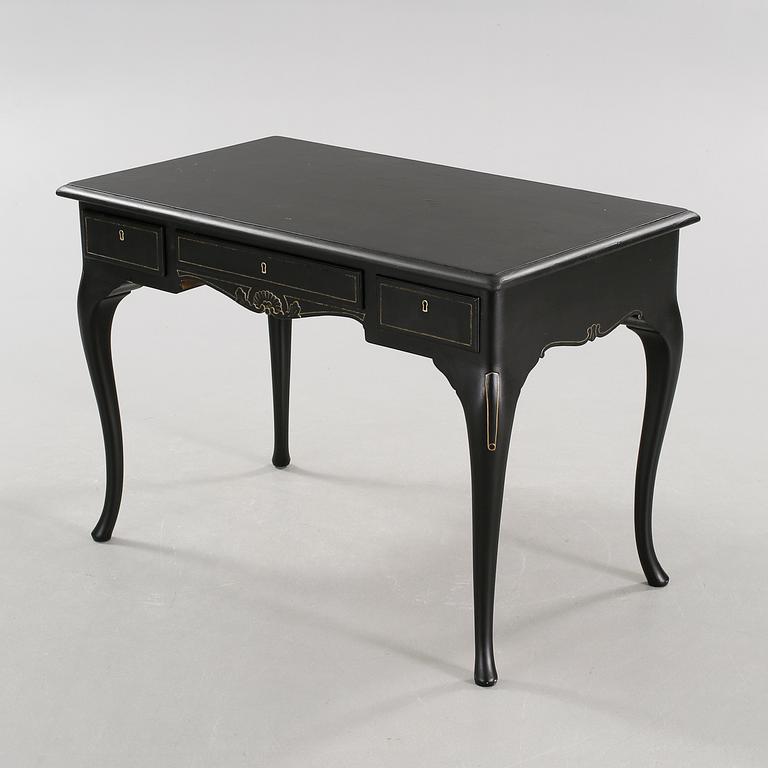 A 20th century desk in the style of rococo.