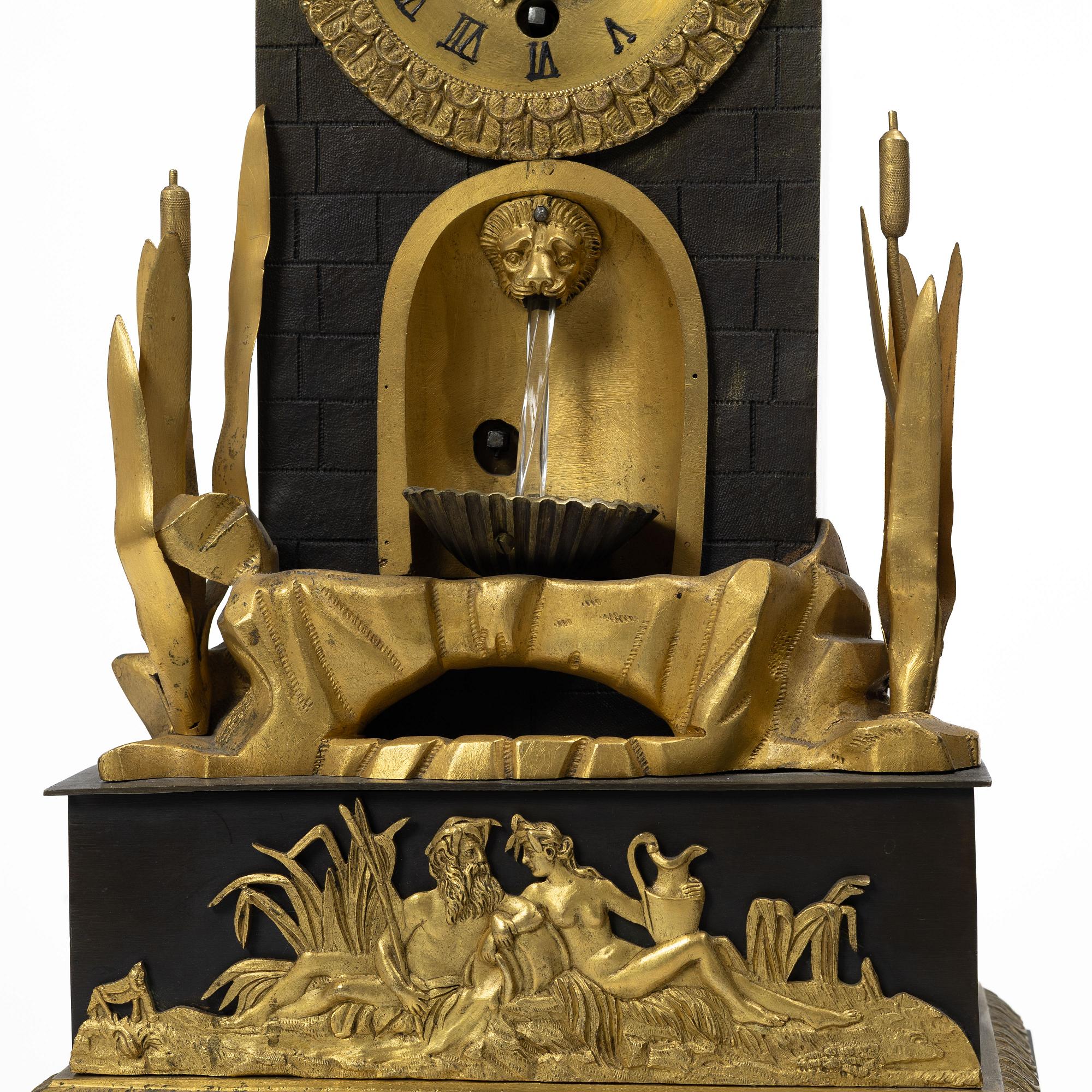 A French Charles X ormolu and patinated bronze mantel clock, ca 1820's.