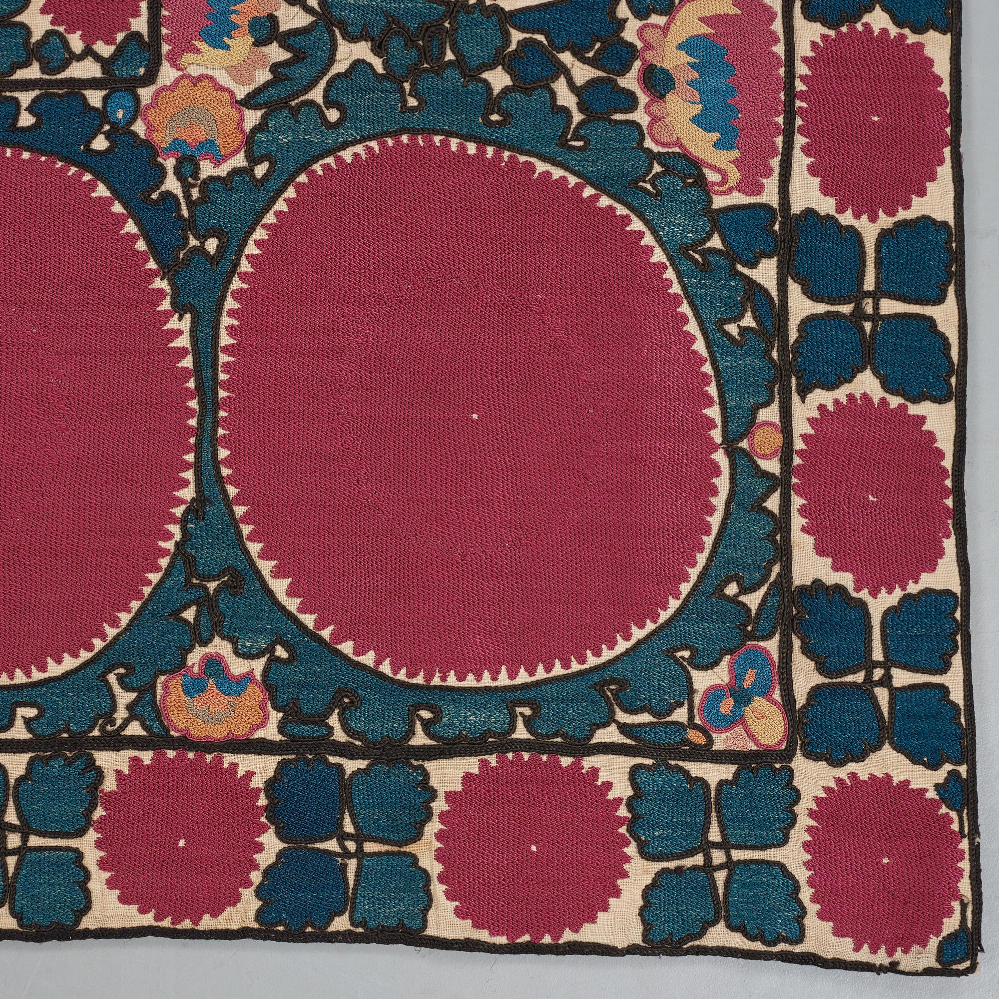 A SUZANI EMBROIDERY, an antique Tashkent, Uzbekistan, ca 217,5 x 112,5 cm.