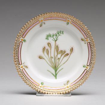 A set of 12 Royal Copenhagen "Flora Danica" bread dishes, Denmark, 20th Century.