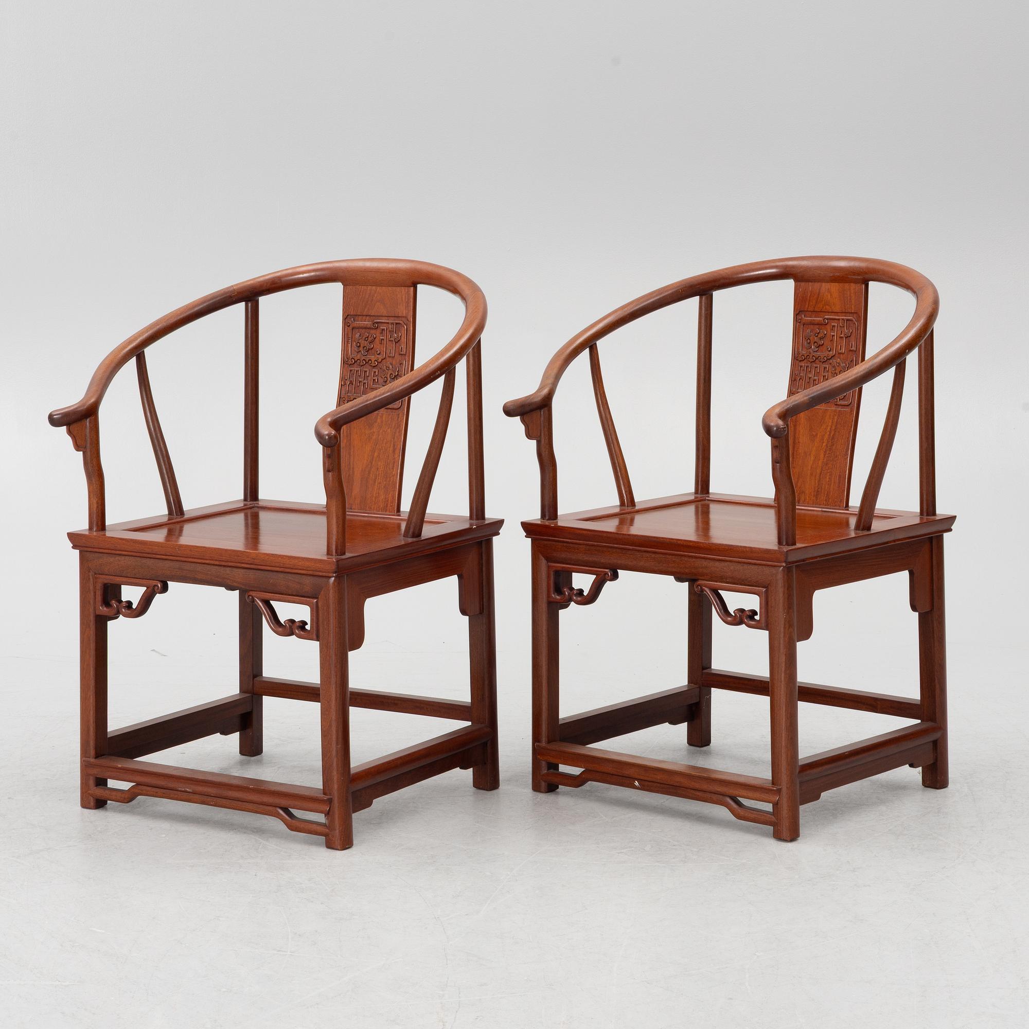 A pair of hardwood 'horse shoe back' hardwood armchairs, Hong Kong, 1960s.