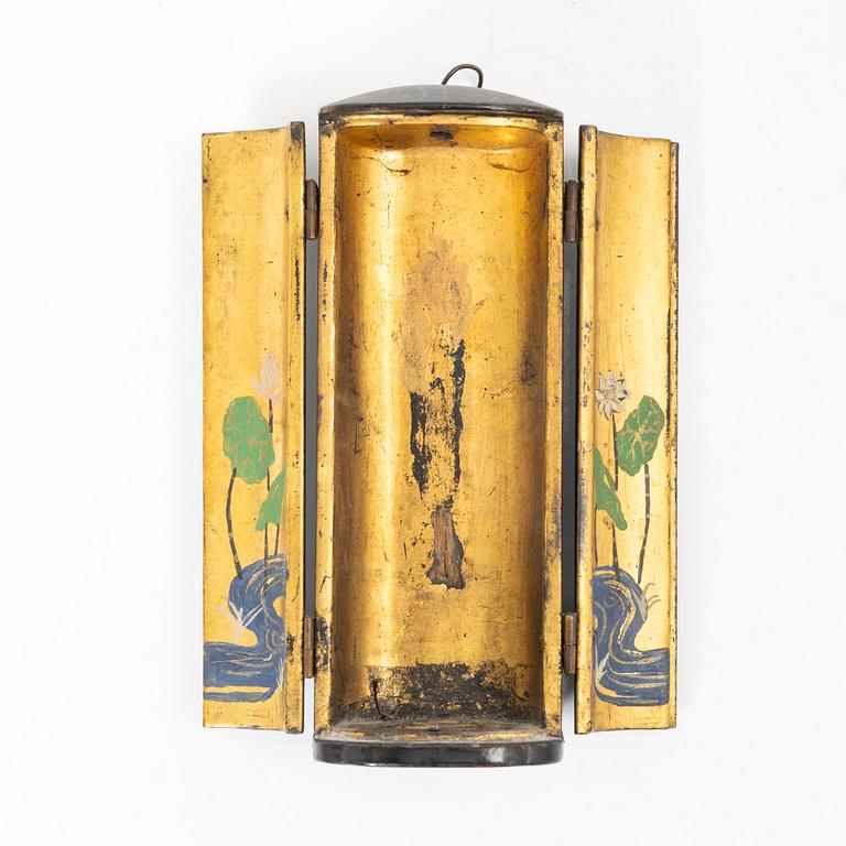 A portable buddhist altar and a figure of 'Weeping Buddha', Japan and Indonesia.