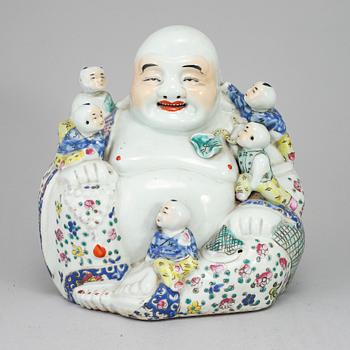 A large famille rose porcelain figure of a buddha with children, 20th century.