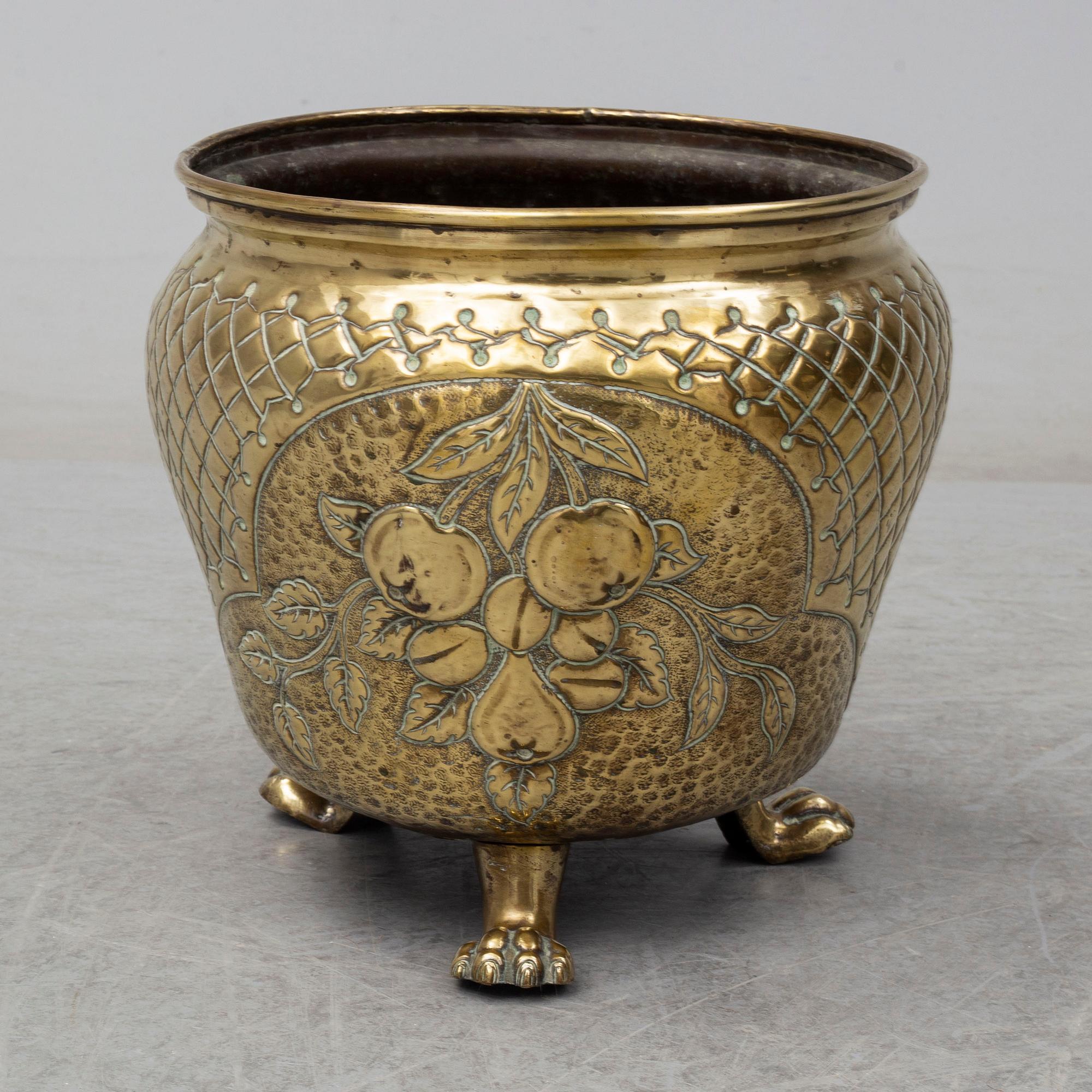 A 18th century brass flower pot.
