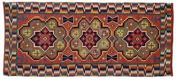 345. A flat weave carriage cushion, c. 110 x 49 cm, southwest Scania, circa 1800-1830.