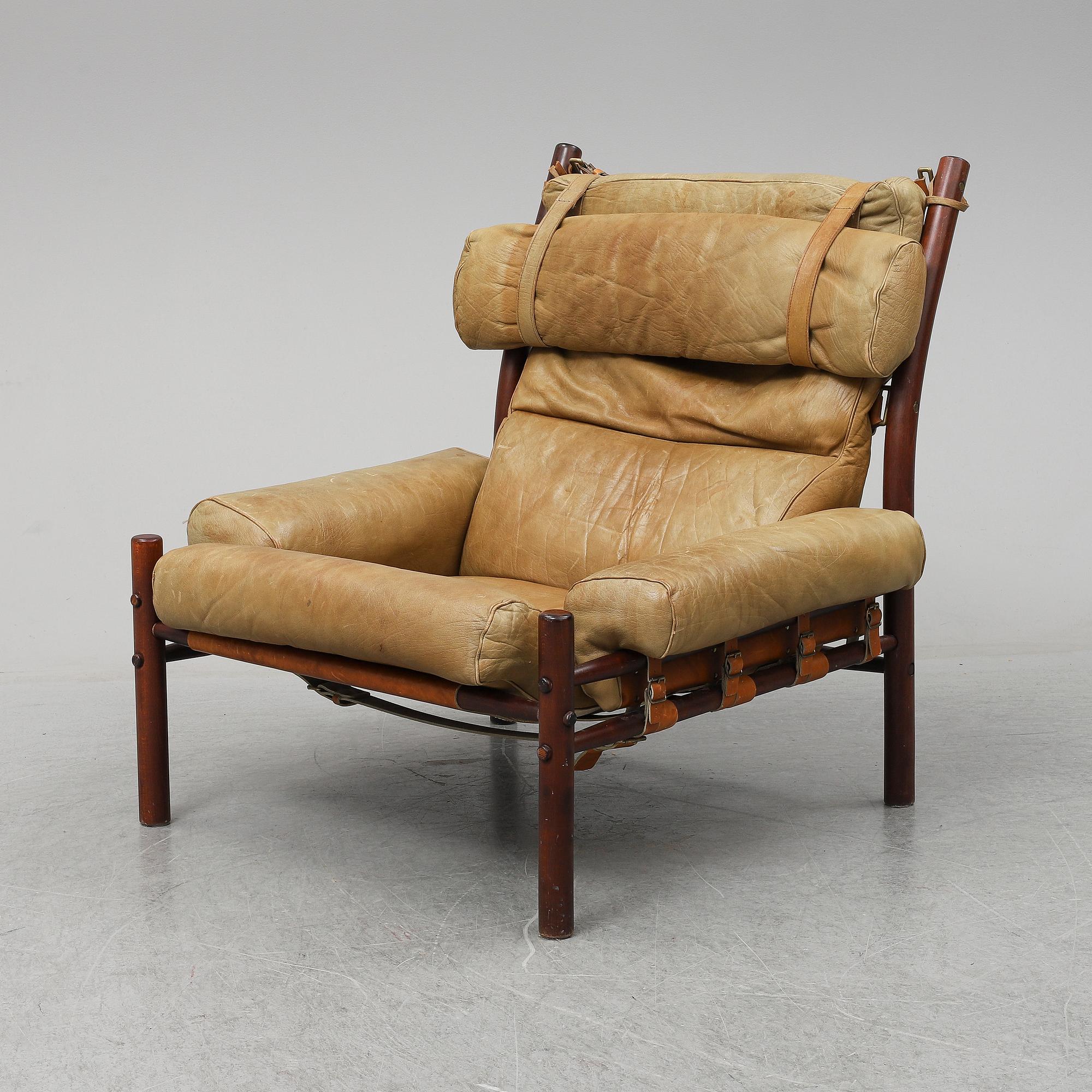 AN ARNE NORELL "INCA" LOUNGE CHAIR.