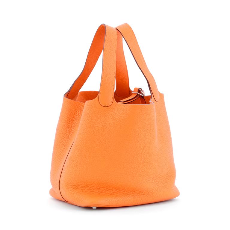 HERMÈS, a orange leather handbag, "Picotin lock".