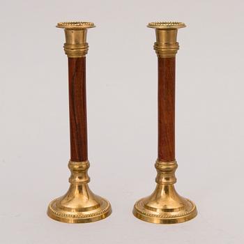 Set of ten 19th/20th Century brass and wood candlesticks.