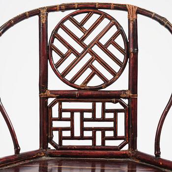 A Chinese bamboo horseshoeback armchair, late Qing dynasty.
