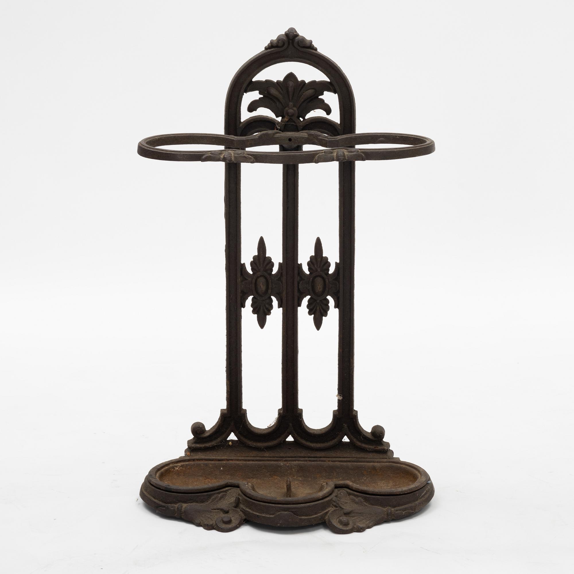 A cast iron umbrella stand, circa 1900.