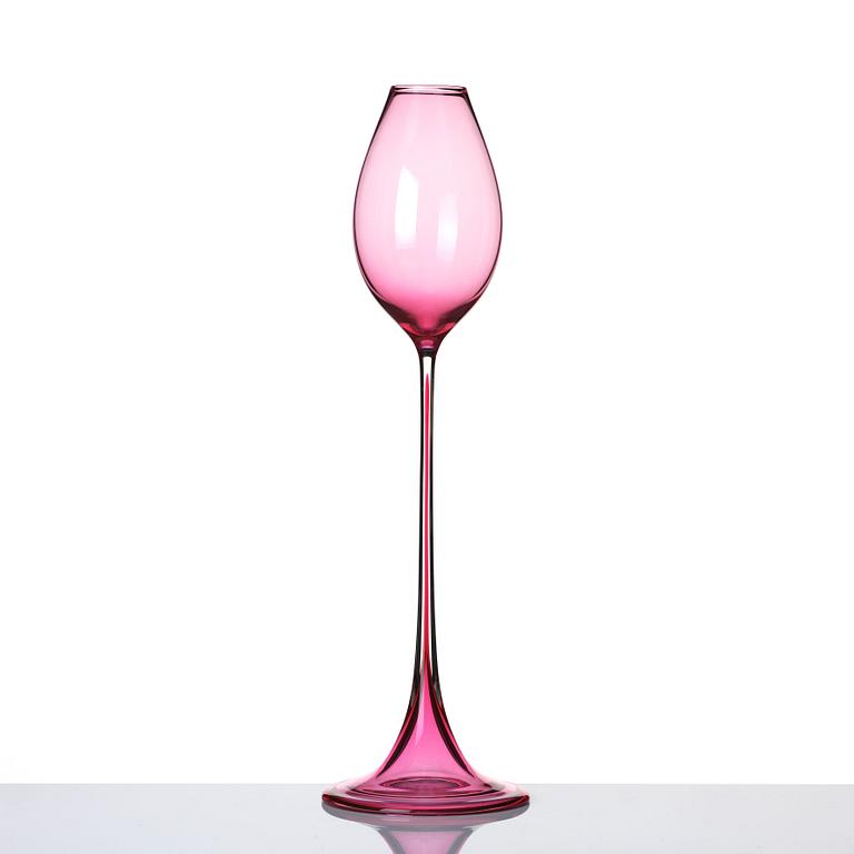 Nils Landberg, a cerise tinted glass goblet, Orrefors Sweden 1957.