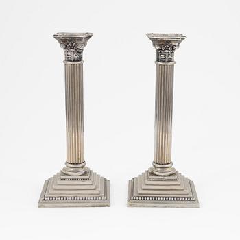 A pair of silver plate Godinger Silver candle holders, 1992.