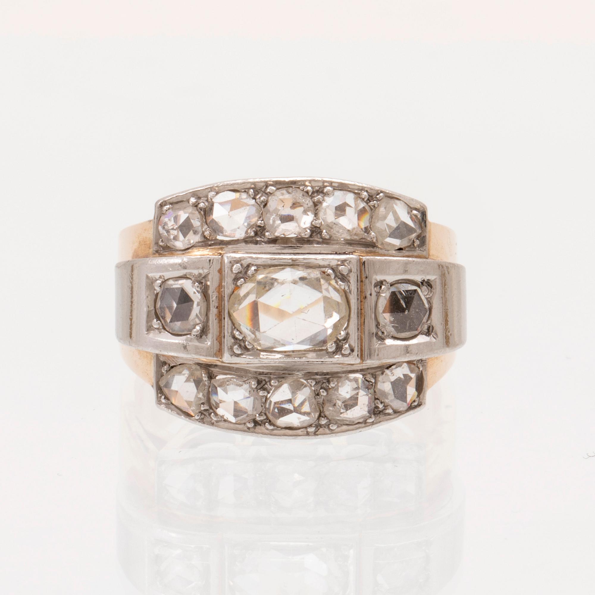 An 18K white and red gold ring set with rose cut diamonds.