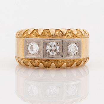 Gold and brilliant cut diamond three stone ring.