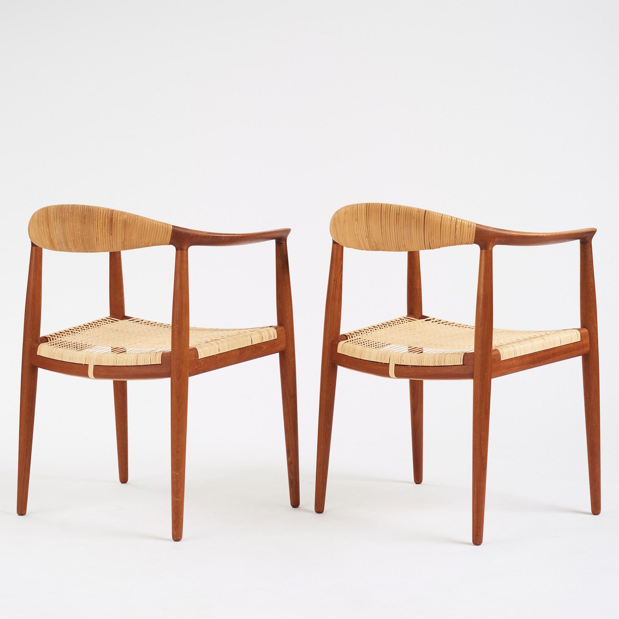 Hans J. Wegner, a pair of teak and rattan 'The Chair', JH-503, Johannes Hansen, Denmark 1950s.