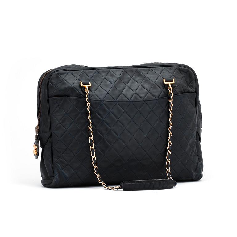 CHANEL, a darkblue leather shoulder bag, 1980s.