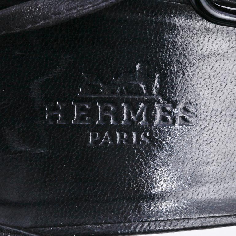 HERMÈS, a pair of black leather sandals. Size 38.