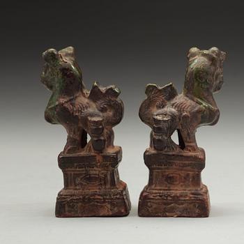 A pair of green and yellow glazed joss stick holders, Ming dynasty (1368-1644).