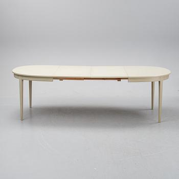 A dining table with six chairs by Carl Malmsten, second half of the 20th Century.