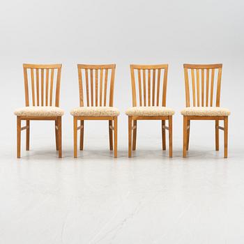 A set of four oak chairs with new  sheepskin upholstery.