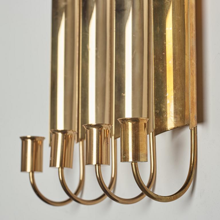 A set of four 'Reflex' brass wall scones by Pierre Forsell, Skultuna.