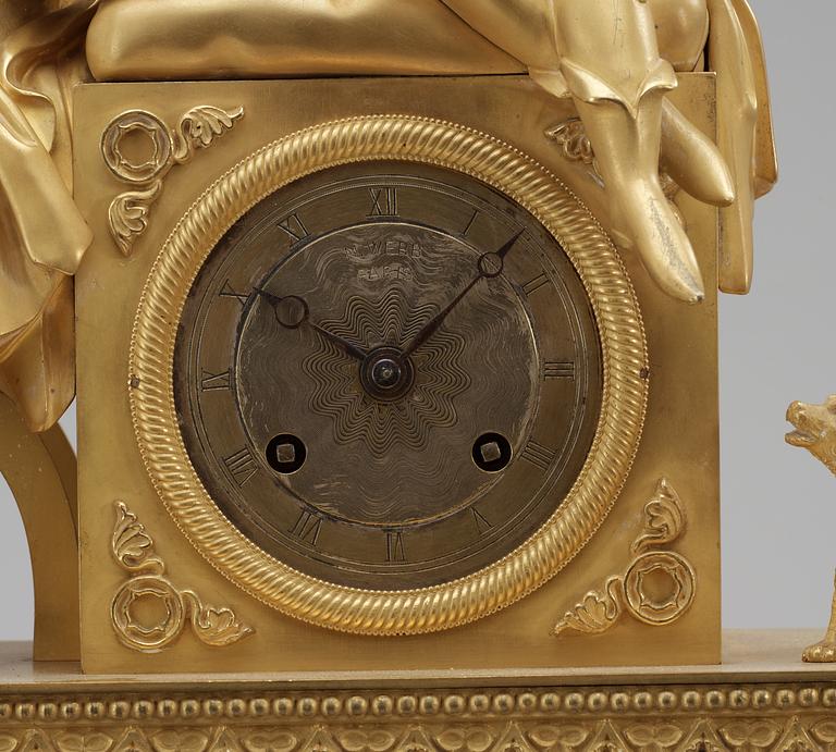 A French neo-Gothic circa 1830 gilt bronze mantel clock.
