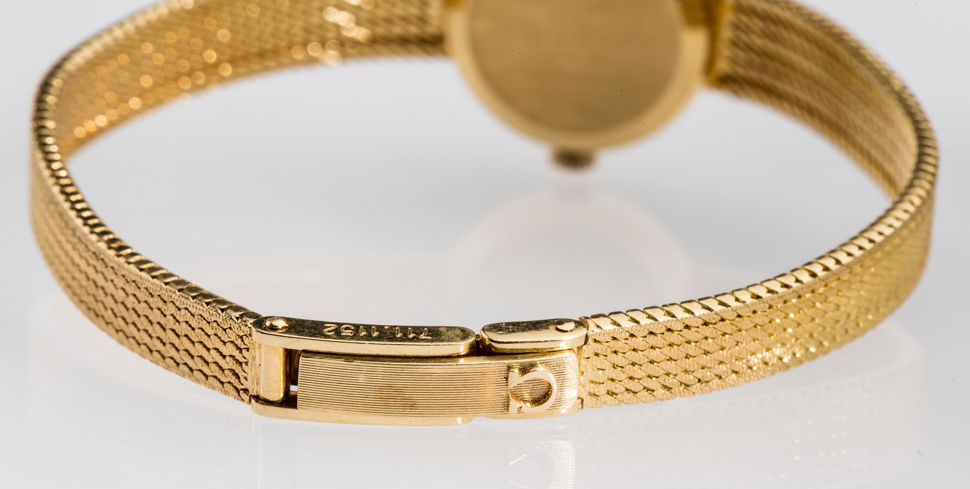 DAMARMBANDSUR, 18 k guld. Omega. Vikt ca 23 g.