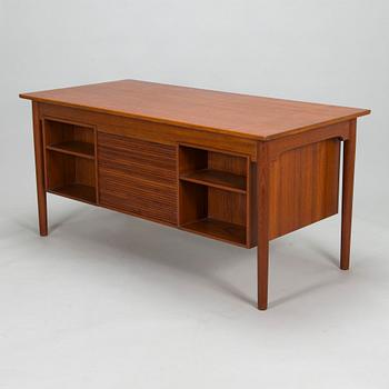 A wooden mid 20th century desk.
