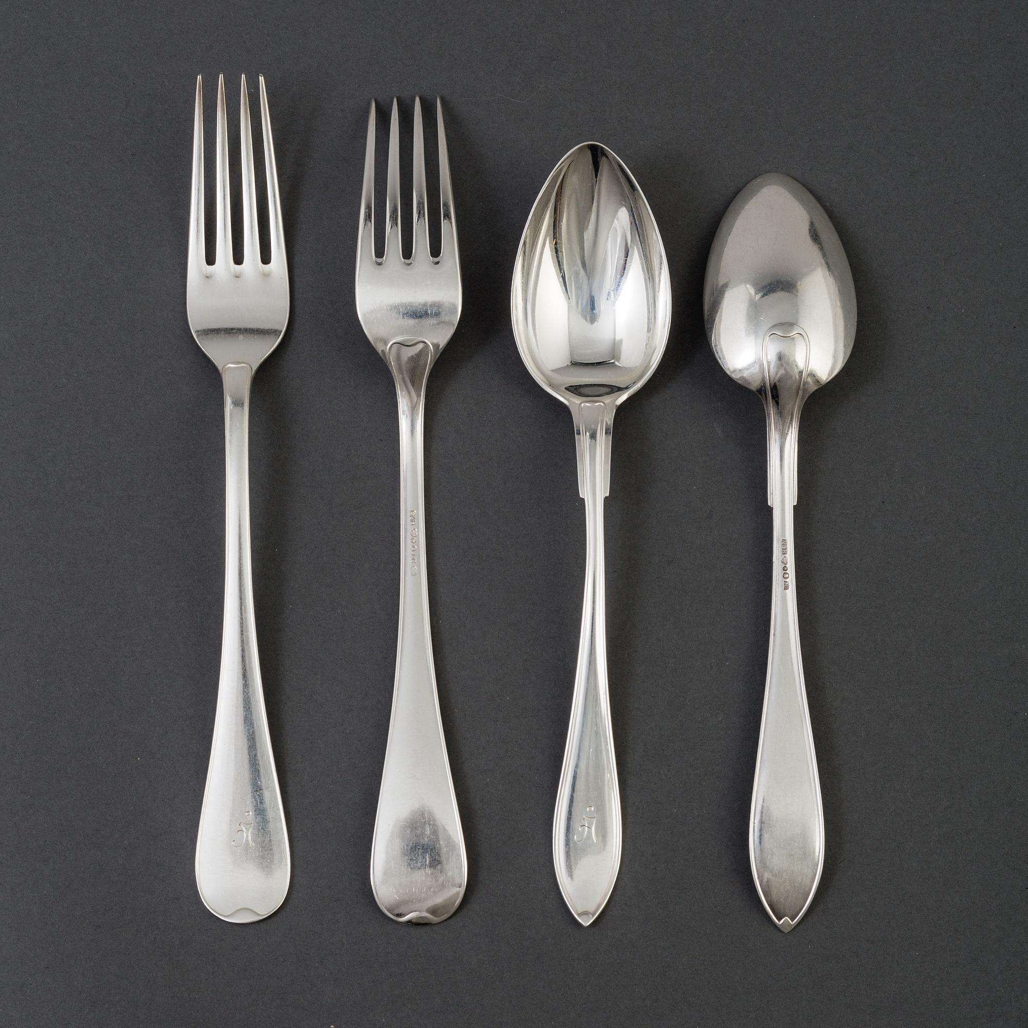12 20th century silver spoons and 10 forks by GAB and Bernhard Hertz, Stockholm.
