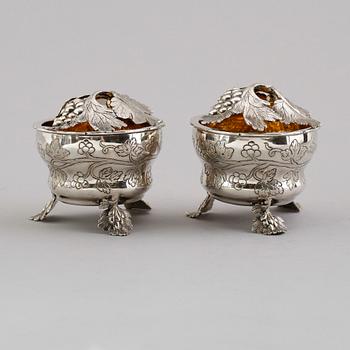 A pair of German 18th century parcel gilt jelly-pots, marks of  Johann Christoph Seelingslow, Magdeburg.