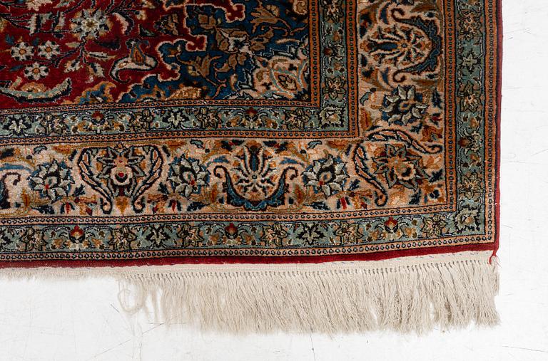A silk Kashmir rug, c. 176 x 121 cm.