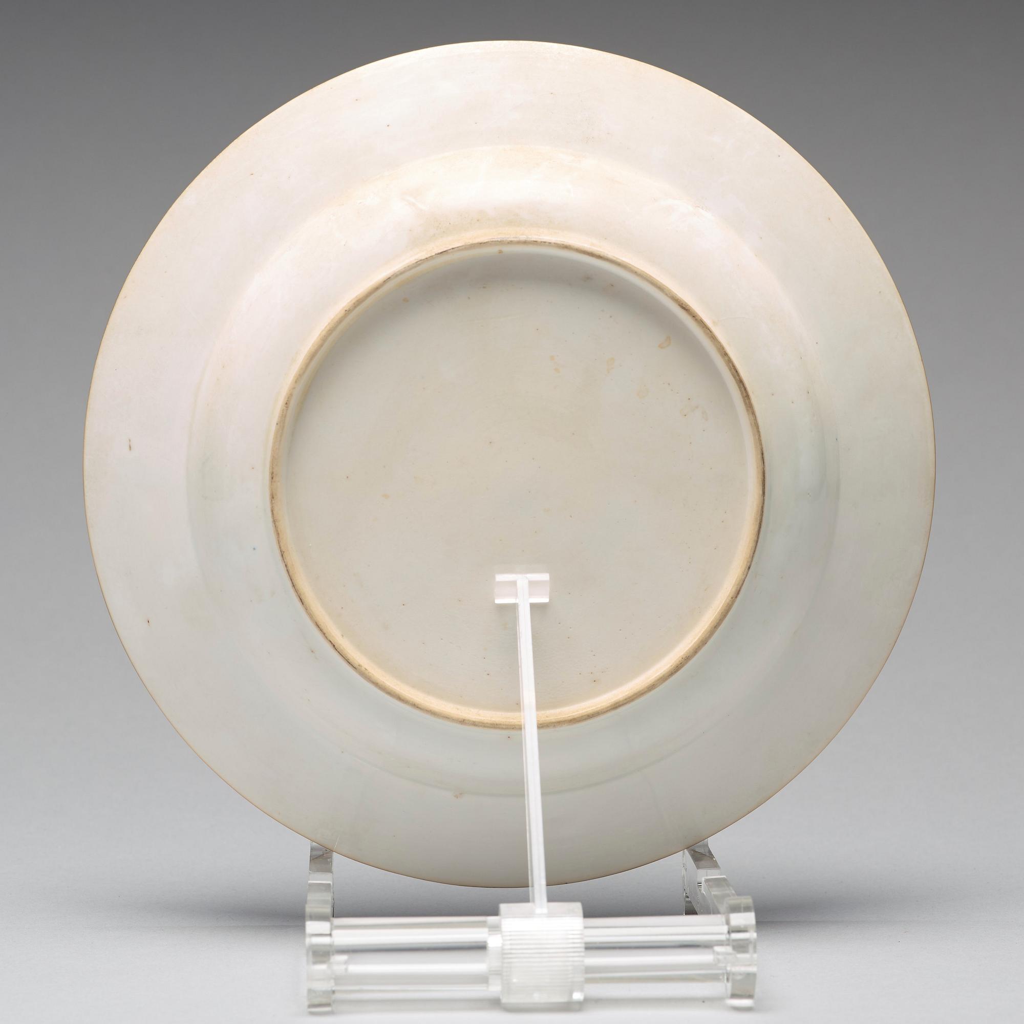 A set of eight blue and white armorial soup dishes, Qing dynasty, 18th Century.